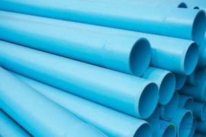 Blue-PVC-Pipes A Picture of a Stack of Blue PVC Pipes